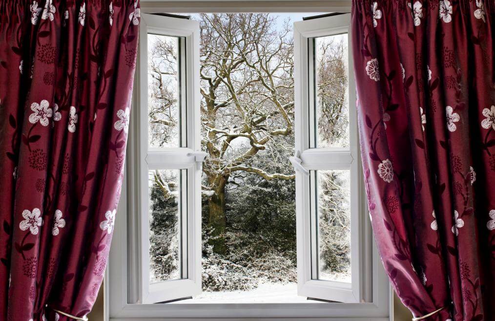 open-window-with-view-to-a-snowy-winter-scene