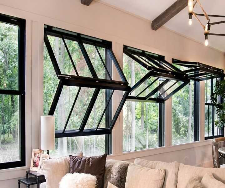 Technician inspecting aluminum fold up window window