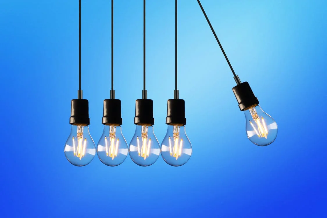A picture of five lightbulbs on a blue background.