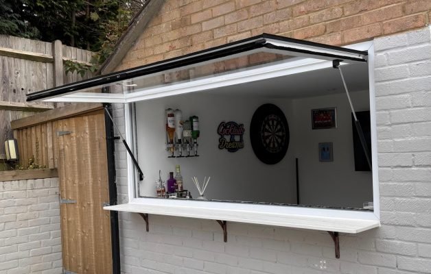 Gas strut pass through window